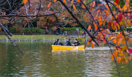 TOKYO, JAPAN - NOVEMBER 19,2019 Tourist rowing  boat at lake inside Ueno Park ,Tokyo in autumn time.Ueno park is tourist destination for spring and autumn view.のeditorial素材