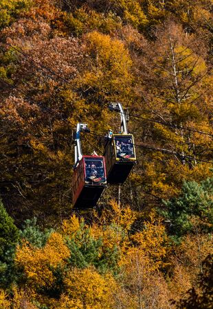 KAWAGUCHIKO,JAPAN-NOVEMBER 20,2019:Tourist going to the top of the mountain by Mt.Kachi Kachi ropeway and another one going down.Top of Mt.Kachi Kachi is panorama view point of Mt.Fuji.のeditorial素材