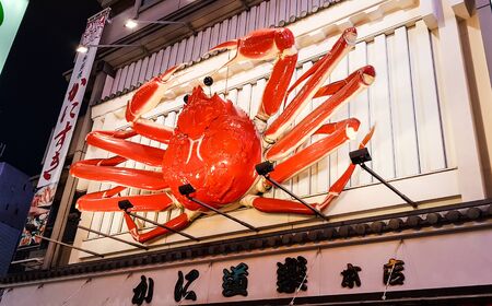 OSAKA, JAPAN - DECEMBER 1, 2019 : Popular crab restaurant at  Dotonbori street in the Namba District. This area is one of the most popular destination for tourist in Osaka city.のeditorial素材