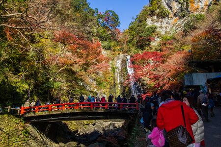 OSAKA,JAPAN-DECEMBER 1,2019:Tourists enjoying waterfall in autumn at Minoo park in Osaka,Japan.Minoo park is one of tourist destination in autumn.のeditorial素材