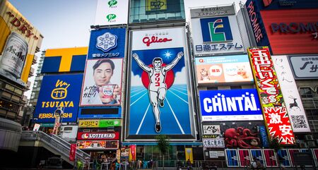 OSAKA, JAPAN -DECEMBER 1,2019:Advertisements  beside the Dotonbori Canal in the Namba District. The canals date from the early 1600's and is a popular nightlife destination.のeditorial素材