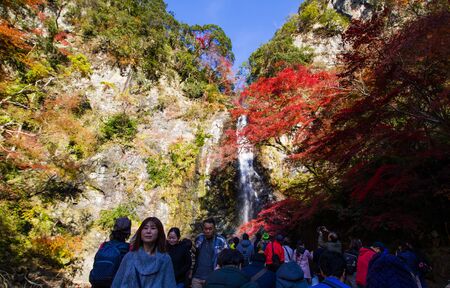 OSAKA, JAPAN - DECEMBER 1, 2019 : Tourists enjoying waterfall in autumn at Minoo park in Osaka,Japan.Minoo park is one of tourist destination in autumn.のeditorial素材