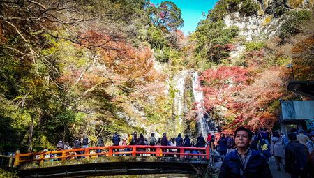 OSAKA, JAPAN - DECEMBER 1, 2019 : Tourists enjoying waterfall in autumn at Minoo park in Osaka,Japan.Minoo park is one of tourist destination in autumn.のeditorial素材
