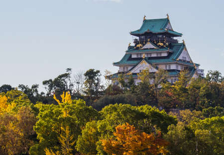 Osaka castle with colorful trees around in autumn.のeditorial素材