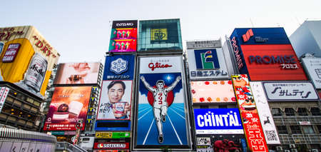 OSAKA, JAPAN -DECEMBER 1,2019:Advertisements  beside the Dotonbori Canal in the Namba District. The canals date from the early 1600's and is a popular nightlife destination.のeditorial素材