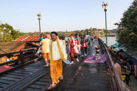 KANCHANABURI, THAILAND-DECEMBER 5,2019: Visitors enjoy walking on Mon bride at Sangkhlaburi in Kanchanaburi, Thailand.This bridge is the longest wooden bridge in Thailand.のeditorial素材