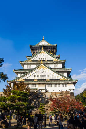 OSAKA,JAPAN-NOVEMBER 29,2019:Visitors enjoying autumn trees around  Osaka castle in Osaka,Japan.This place is the most popular place for visitor in Osaka.のeditorial素材
