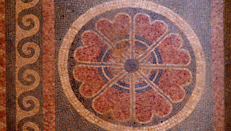 Fragment of an ancient geometrical colorful floor mosaic in Herod`s Palace, Massad, Israel. The...