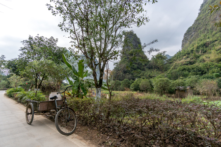 Panoramic view of green mountains reflected in still water. Yangshou, Chinaの写真素材
