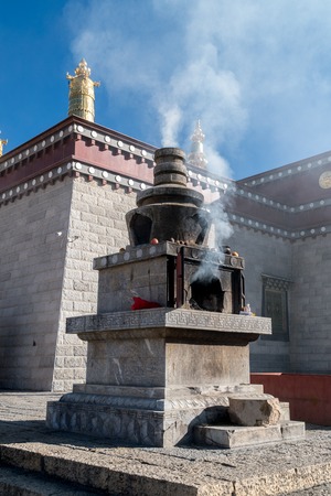 Shangri-la central square, Guishan Si temple and biggest buddhist wheel in the world, Yunnan province, China.の写真素材
