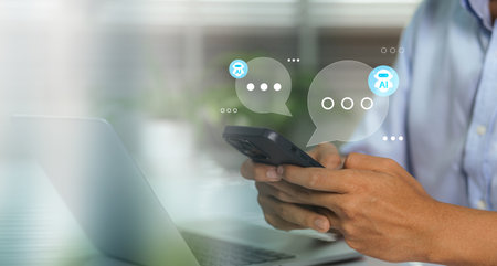 Business man using digital chatbot application Artificial Intelligence at home for online customer service. AI Chat Technology for Seamless Communication and Customer Engagement.の写真素材