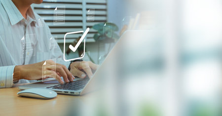 Businessman checking Document Management System (DMS) and approve. Streamline online docs, enhance file control and workflow efficiency with e-documents.の写真素材