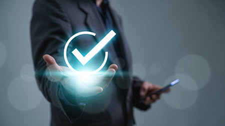 A businessman is shown checking the appropriate boxes in the quality document control checklist,...