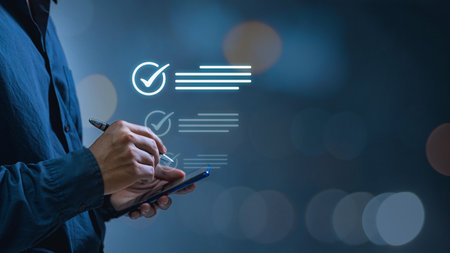 A businessman manages files well using his laptop to choose the approve box for task management using a checklist and clipboard, a document management system (DMS), and process automation.の写真素材