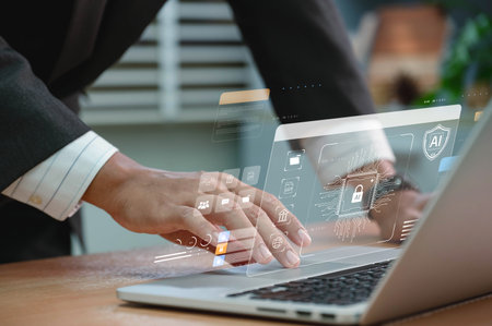 Network cybersecurity and privacy using artificial intelligence to safeguard data. AI technology is being used by a businessman to protect data management and information to cyberattacks.の写真素材