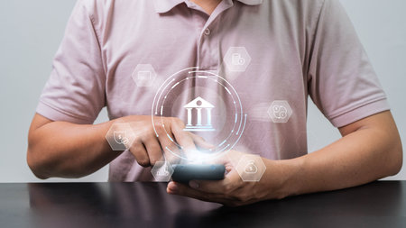 Finance and banking network concept. Businessman making payments and using mobile online banking  on the internet marketing. making retirement investments, purchasing stocks and mutual funds.の写真素材