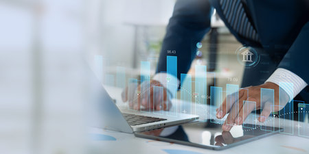 Finance and data analysis. Businessman doing investment and financial analytics utilizing technology...
