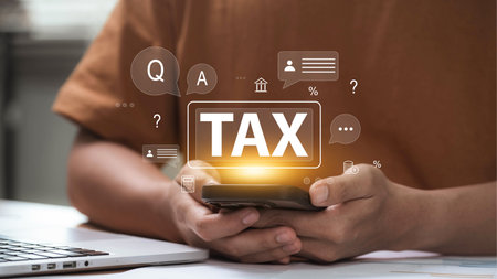 Mobile user accessing tax return services through smartphone with financial icons and chat bubbles, showing online filing help, digital consultation, and income tax assistance via mobile deviceの写真素材