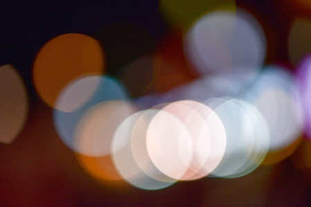 abstract colorful defocused circular facula, abstract background. Night city street lights bokeh background.の写真素材