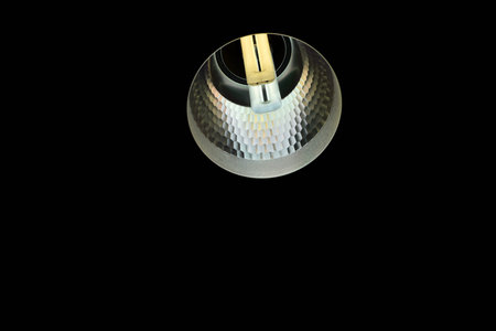 Wall lamp illuminated white wall with textured wallpaper, spotlight background