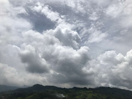 Blue White Sky Background Mountain Wallpaper with Cloudsの写真素材