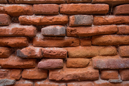 Background of ancient red brick wallの写真素材