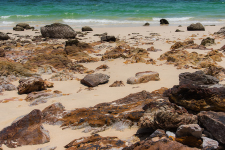 Rock and sand with blue seaの写真素材