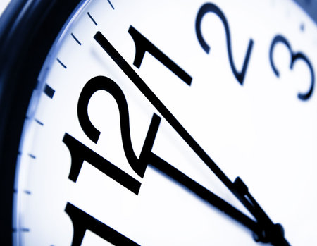 Office clock about to show 12'o clock - good metaphor for running out of time