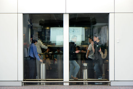 Hongkong International Airport, March 31, 2010. People smoking inside a special smoking room at...