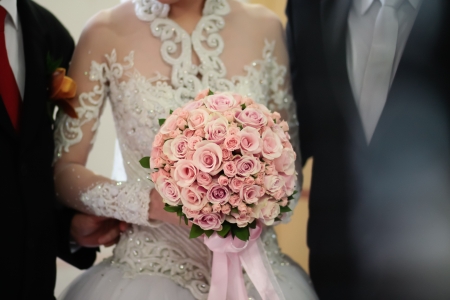 INDONESIA, JAKARTA, 9th March 2012. Bride escorted by her father to the groom.のeditorial素材