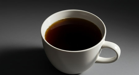 Cup of coffee on a black background. Close-up.の素材