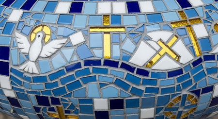 Close up of a blue and yellow mosaic with a white dove.の素材