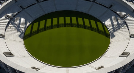 Aerial view of a football stadium with green grass in summer.の素材
