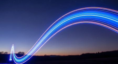 Blue light trails in the night sky. Long exposure photograph with a long exposure.の素材
