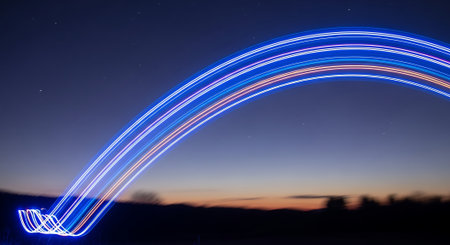 Blue light trail in the night sky. Long exposure photo taken with long exposure.の素材