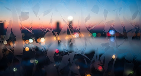 Double exposure of cityscape and bokeh lights at sunset.の素材