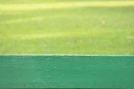 Green wood at bottom and blurred green natural in background, copy space for textの写真素材