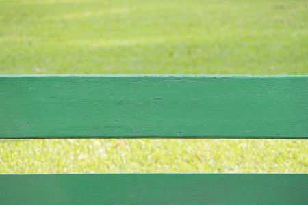 Green wood at bottom and blurred green natural in background, copy space for textの写真素材