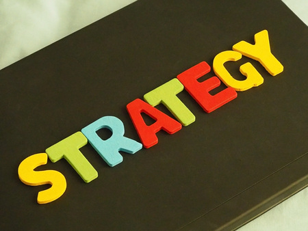 Colorful of Strategy word on black background. Business strategy concept. Marketing strategy concept.の写真素材