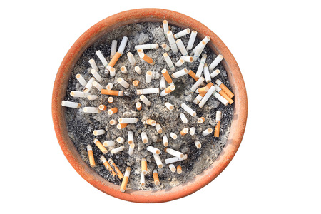 Cigarette butts in the ashtray isolated in white background. The concept of World No Tobacco Day in 31 May, stop smoking, do not smoke, quit smoking, protect your health and other.の写真素材