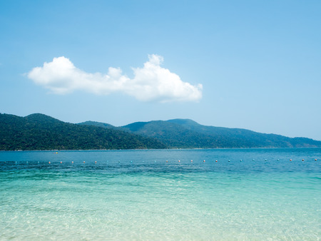 Beautiful Island in ocean sea with crystal green blue water sea and clear blue sky. Happy summer time concept.の写真素材
