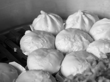 Black and white local Chinese food steamed dumpling or steamed buns steaming in pot. (selective focus)の写真素材