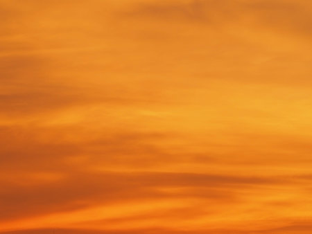 Blur beautiful bright orange sky at sunset sunrise background. Abstract orange sky. Dramatic golden...