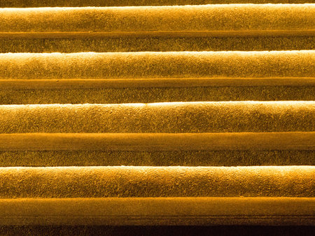 Abstract perspective unique golden, yellow and orange from light on cement stair for background.の写真素材
