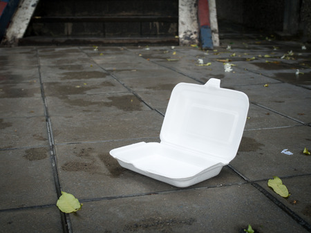 Styrofoam waste on road. Styrofoam waste from foam box for takeaway food make road dirty. Environment problems concept.の写真素材