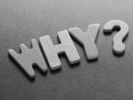 Why word from wood. Black and white of wooden why question mark on black background.