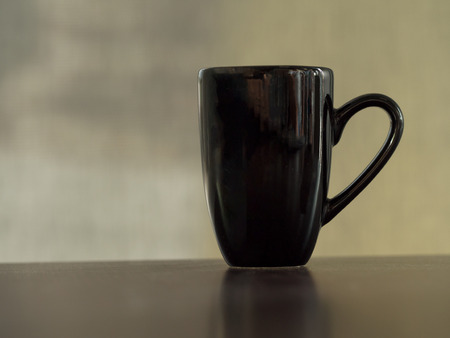 Clean clack coffee mug cup on table vintage tone.の写真素材