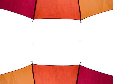 Red orange yellow umbrella isolated on white background.の写真素材