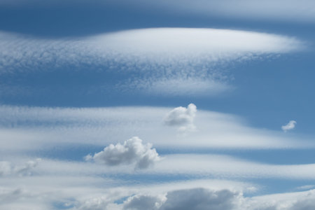Fantastic white clouds in the blue sky on a sunny day