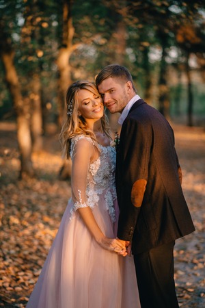 portrait of happy newlyweds during a walk in the forest, close-upの写真素材